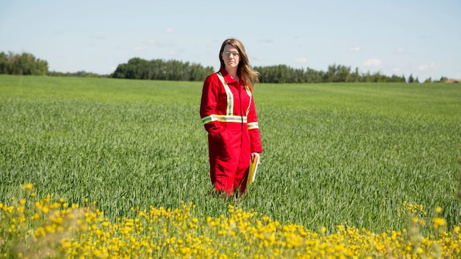 an employee stands in a field