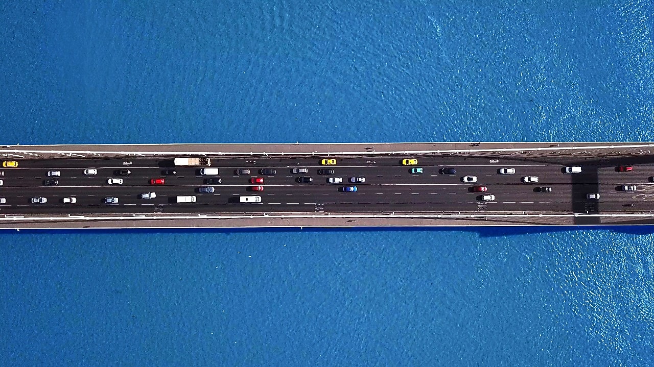 cars on a bridge header image