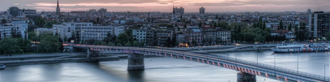 bridge over river during sunset