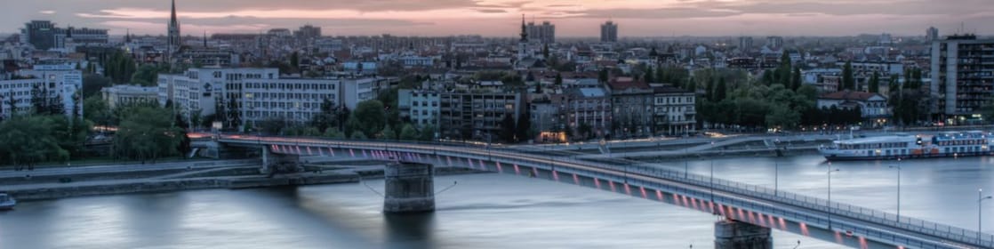 bridge over river during sunset