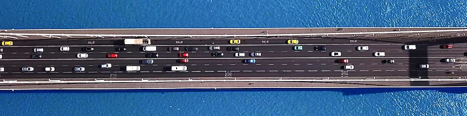 cars on a bridge header image