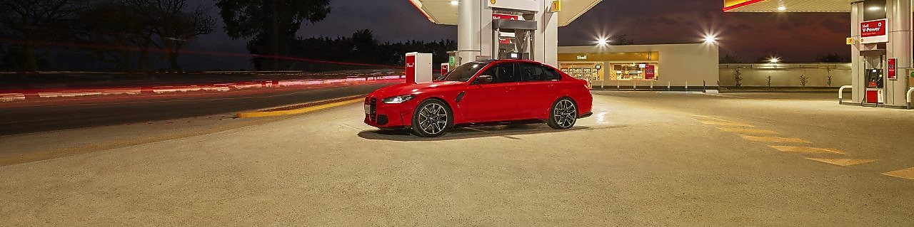 Shell infinity car infront of Shell station