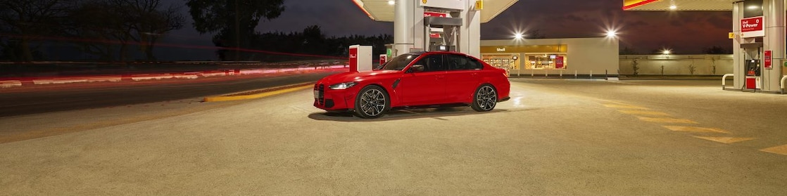 Shell infinity car infront of Shell station