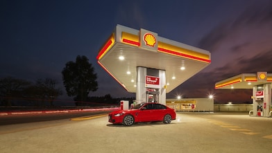Shell infinity car infront of Shell station