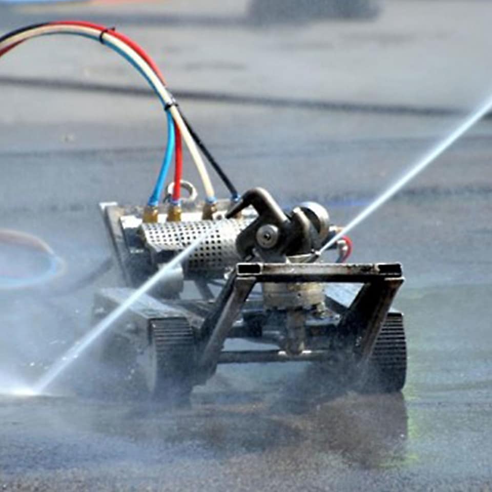 cleaning robot spraying water